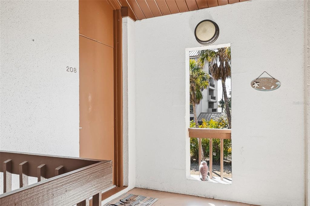 208 Pass Key Road, Unit 208 Sarasota, FL 34242 - Photo 4 of 29 a view of entryway and kitchen