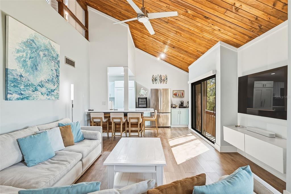 208 Pass Key Road, Unit 208 Sarasota, FL 34242 - Photo 5 of 29 a living room with furniture and a outdoor space