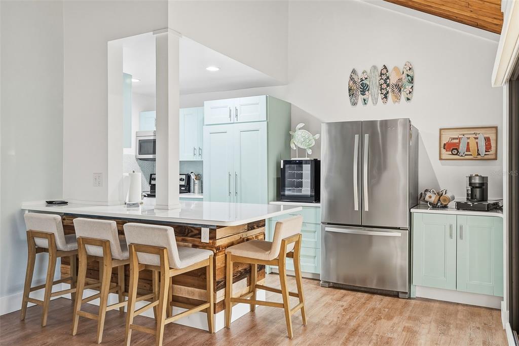 208 Pass Key Road, Unit 208 Sarasota, FL 34242 - Photo 8 of 29 a kitchen with granite countertop cabinets and stainless steel appliances