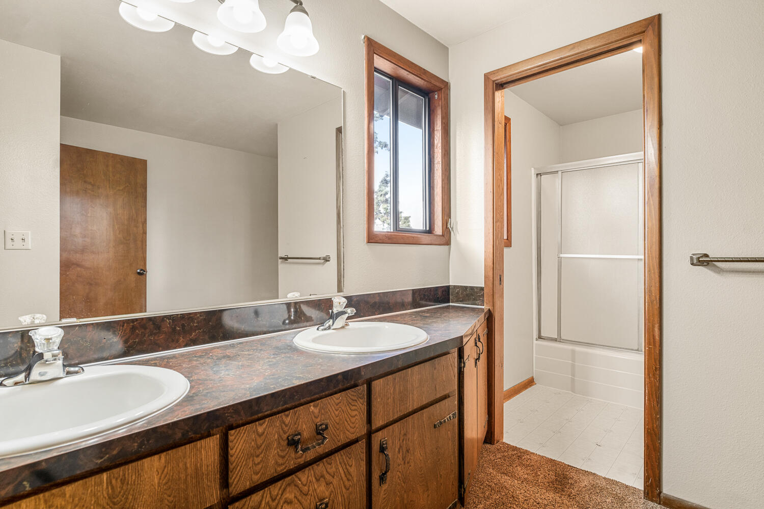 62255 Wallace Road Bend, OR 97701 - Photo 27 of 51 a bathroom with a sink double vanity and a mirror