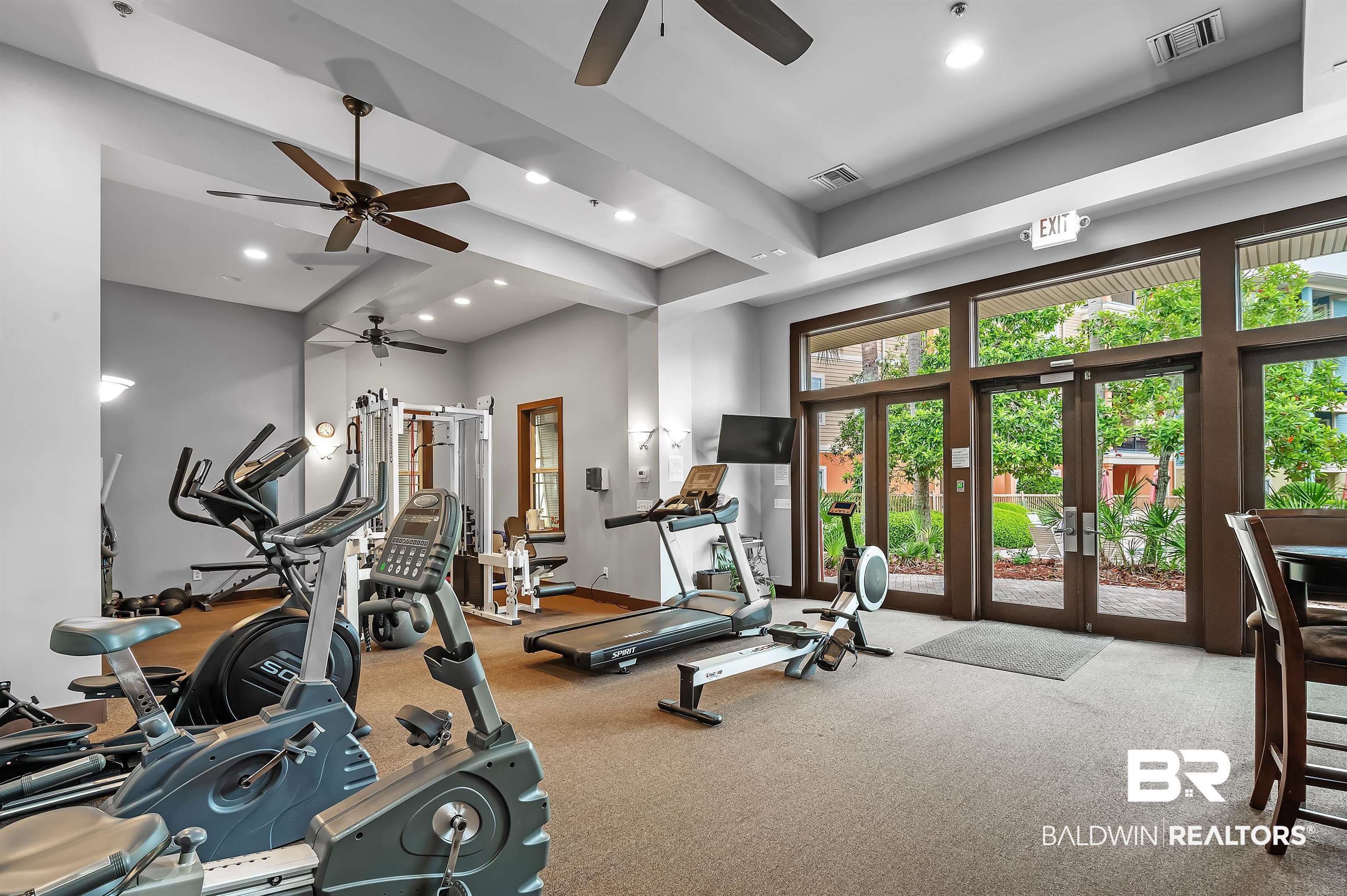 1430 Regency Road, Unit A301 Gulf Shores, AL 36542 - Photo 41 of 47 Workout area featuring french doors, ceiling fan, and carpet floors