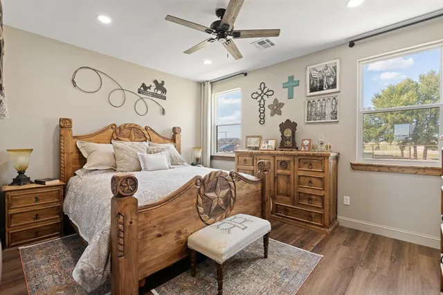 a bed room with a bed window and a chair