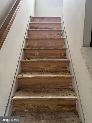 an empty room with windows and entrance