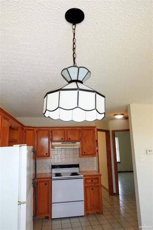 3401 North Inspiration Road, Unit 1 Mission, TX 78573 - Photo 9 of 9 a kitchen with stainless steel appliances a stove a refrigerator and cabinets