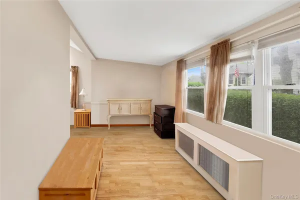 a view of a room with a window and a kitchen