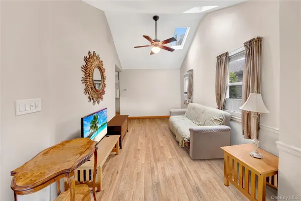 a bedroom with furniture and a wooden floor