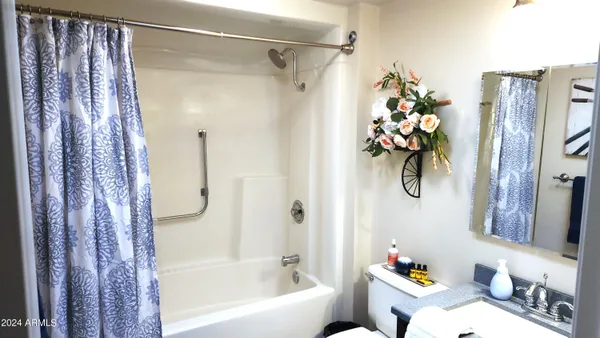 a bedroom with bed and window