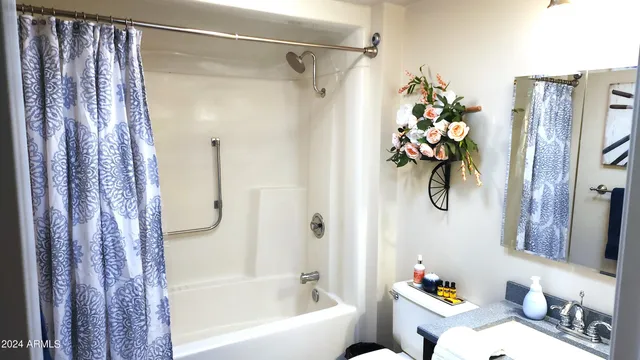 a bedroom with bed and window