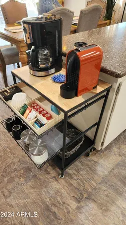 a large kitchen with stainless steel appliances kitchen island granite countertop a sink and cabinets