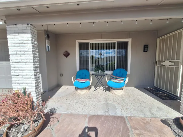 a living room with furniture and flat screen tv