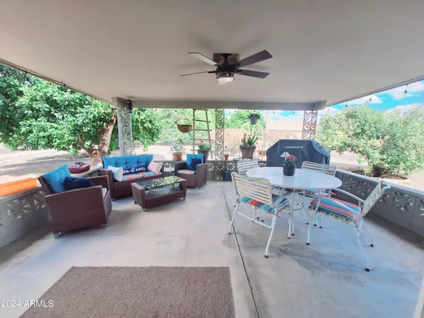 a kitchen with a table chairs and a refrigerator