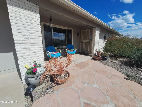 a view of outdoor sitting area with furniture