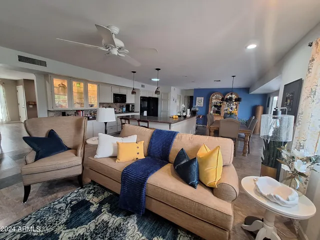 a view of a porch with furniture and a potted plant