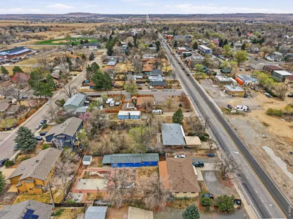 an aerial view of residential houses with outdoor space
