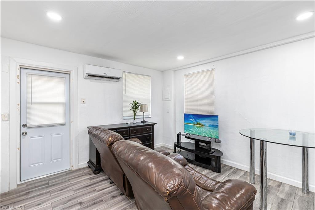 3132 Francis Avenue Naples, FL 34112 - Photo 15 of 23 a living room with furniture and a flat screen tv