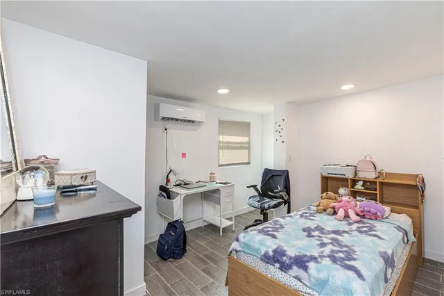 a bed room with a bed and furniture