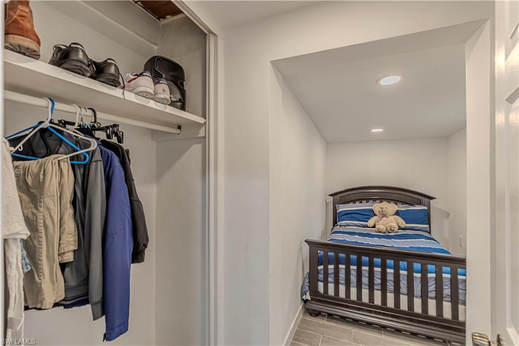 3132 Francis Avenue Naples, FL 34112 - Photo 19 of 23 a bedroom with a bed and closet