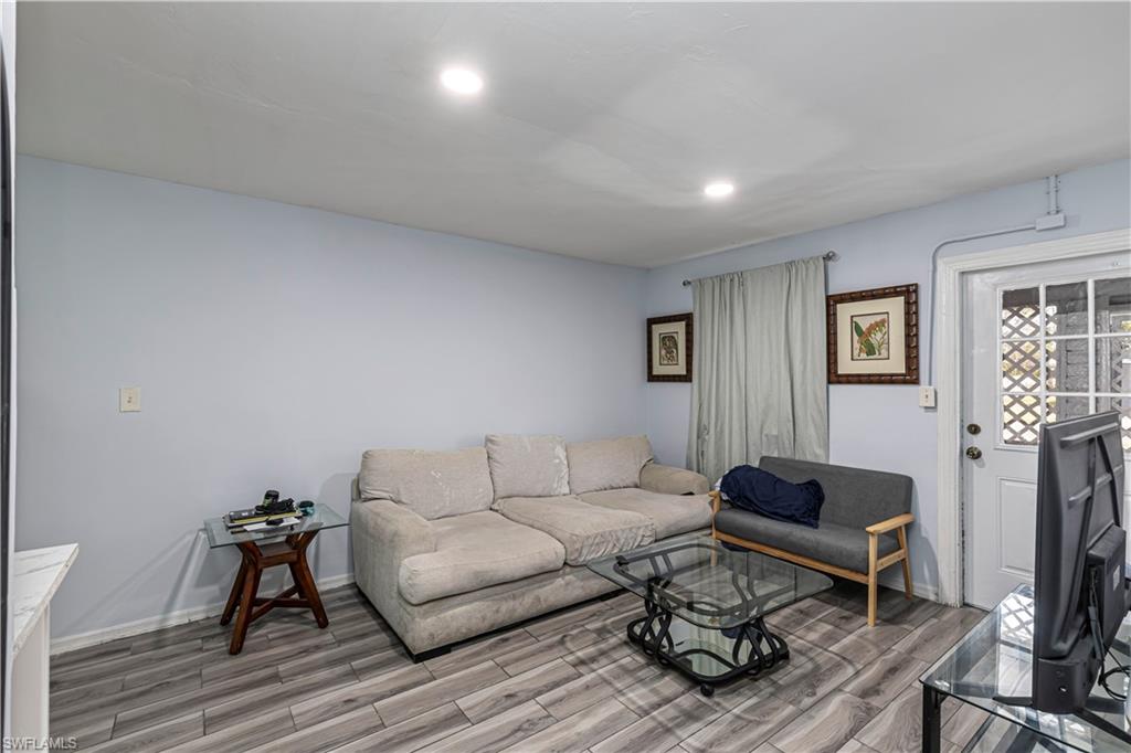 3132 Francis Avenue Naples, FL 34112 - Photo 3 of 23 a living room with furniture and a wooden floor