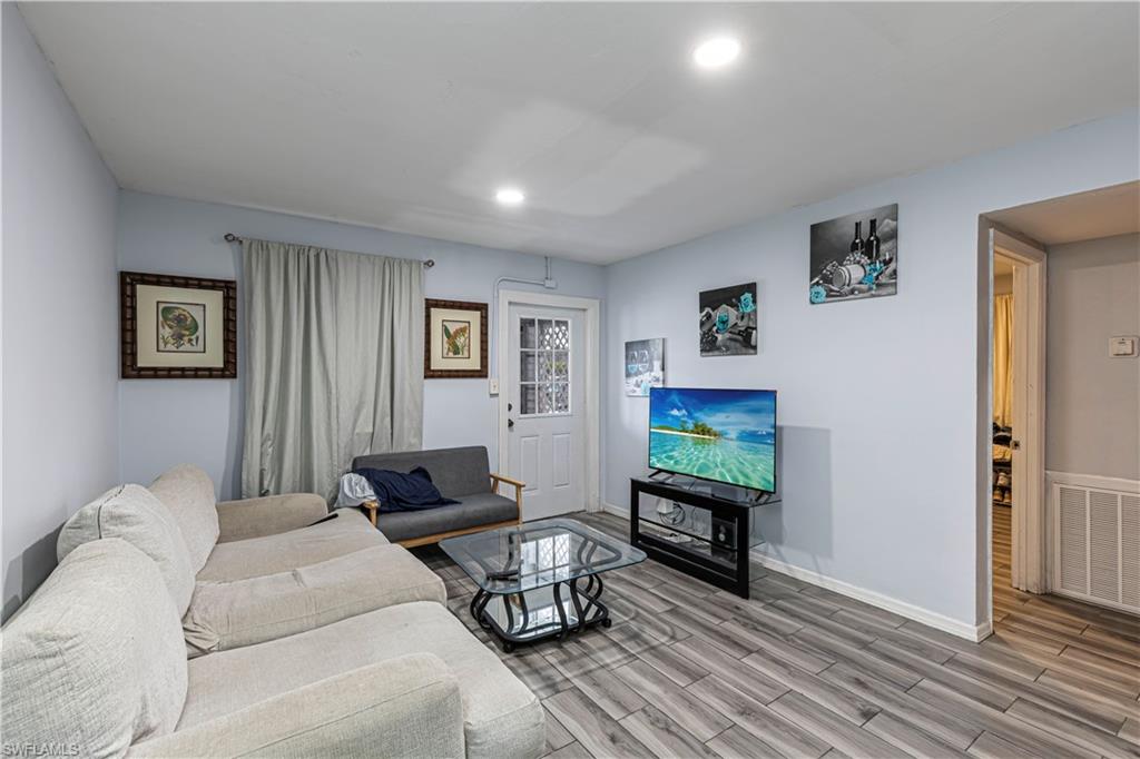 3132 Francis Avenue Naples, FL 34112 - Photo 4 of 23 a living room with furniture and a flat screen tv