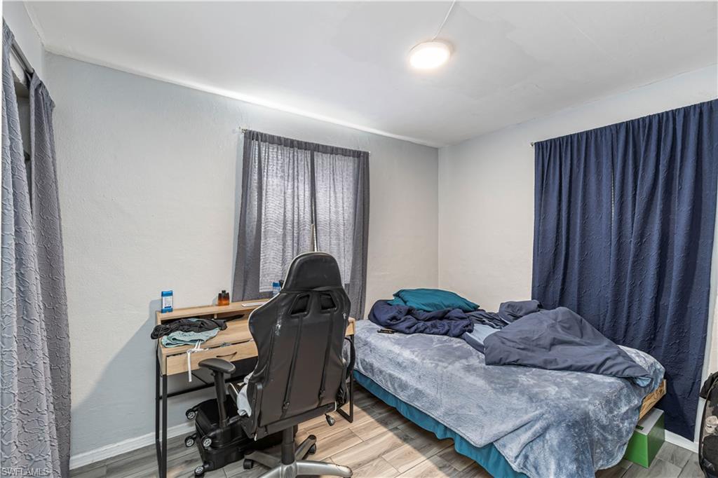 3132 Francis Avenue Naples, FL 34112 - Photo 6 of 23 a bedroom with a bed and a window