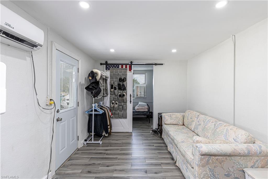 3132 Francis Avenue Naples, FL 34112 - Photo 9 of 23 a living room with furniture and a ceiling fan