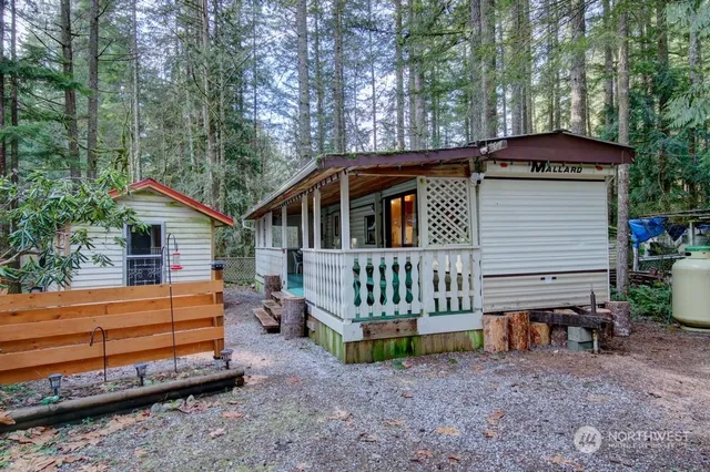 a backyard of a house with oven and a yard