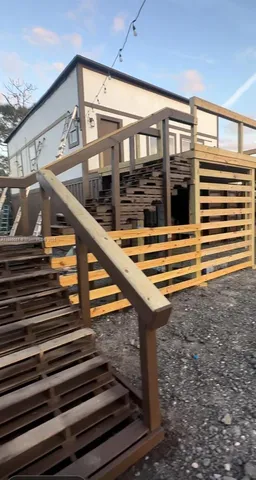 a view of a house with a backyard