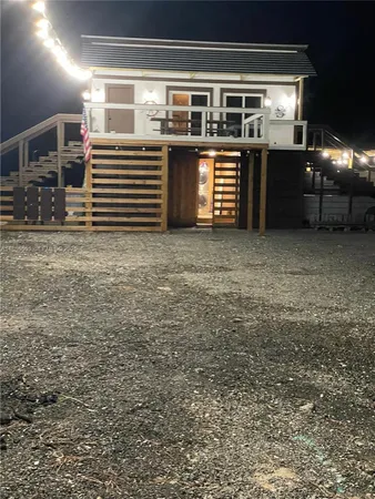 a dining room with furniture and a rug