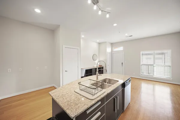 a kitchen with a stove and a refrigerator
