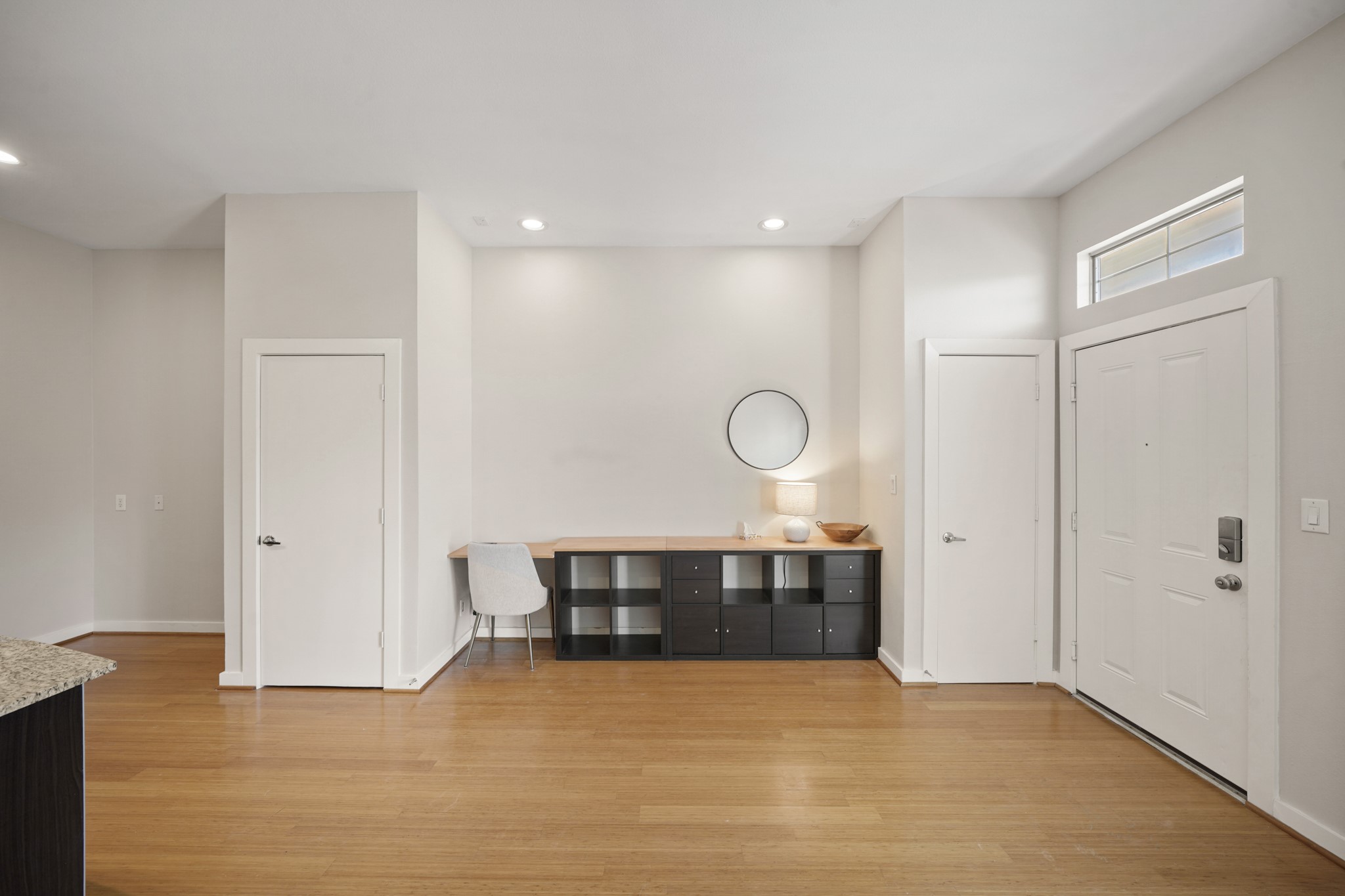 806 Jackson Hill Street, Unit 302 Houston, TX 77007 - Photo 6 of 26 a view of a room with wooden floor and bathroom