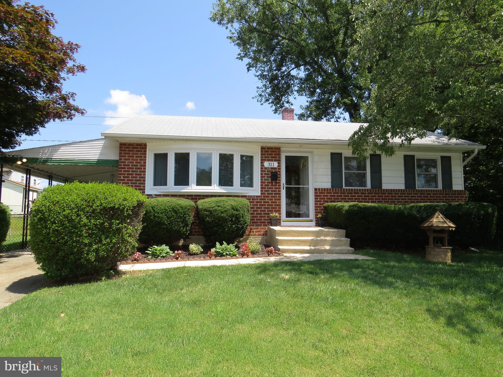 311 Highfalcon Road Reisterstown, MD 21136 - Photo 1 of 24 a front view of a house with a yard