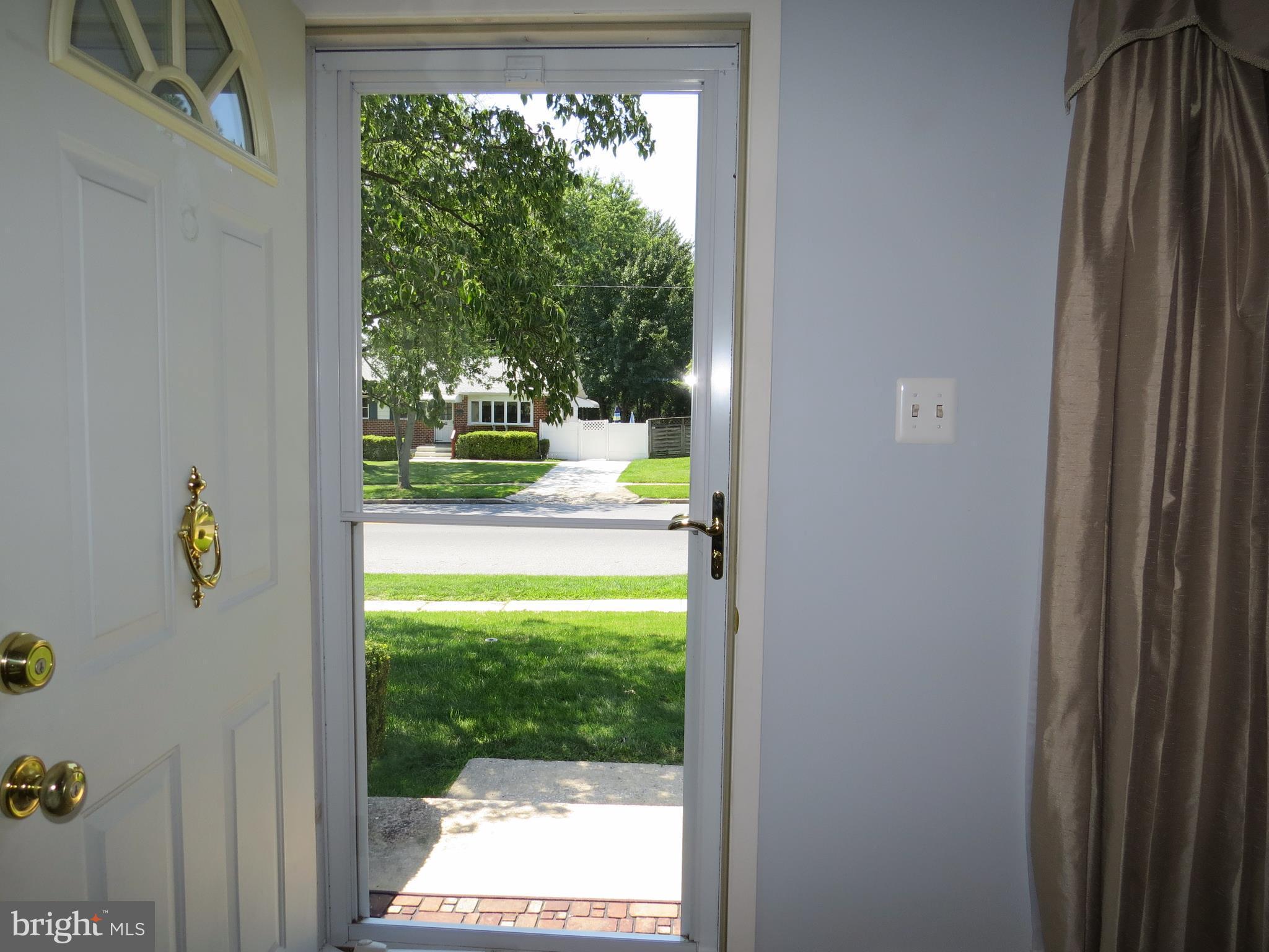 311 Highfalcon Road Reisterstown, MD 21136 - Photo 14 of 24 a view of a room with a large window and plants
