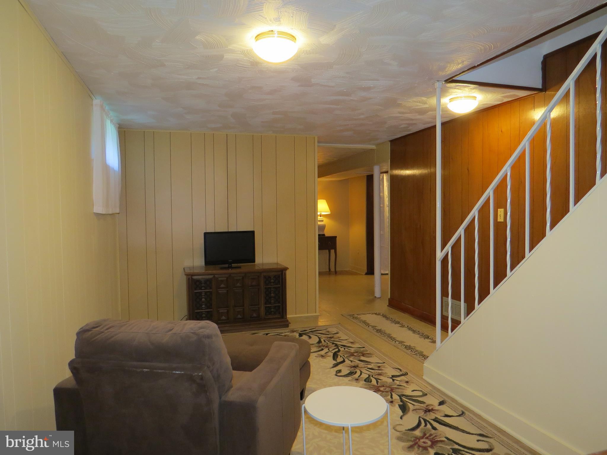 311 Highfalcon Road Reisterstown, MD 21136 - Photo 16 of 24 a living room with furniture and a flat screen tv