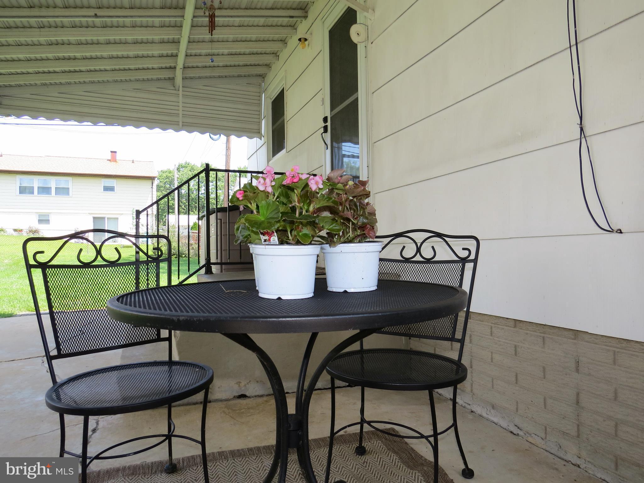 311 Highfalcon Road Reisterstown, MD 21136 - Photo 22 of 24 a view of a table and chairs in a patio