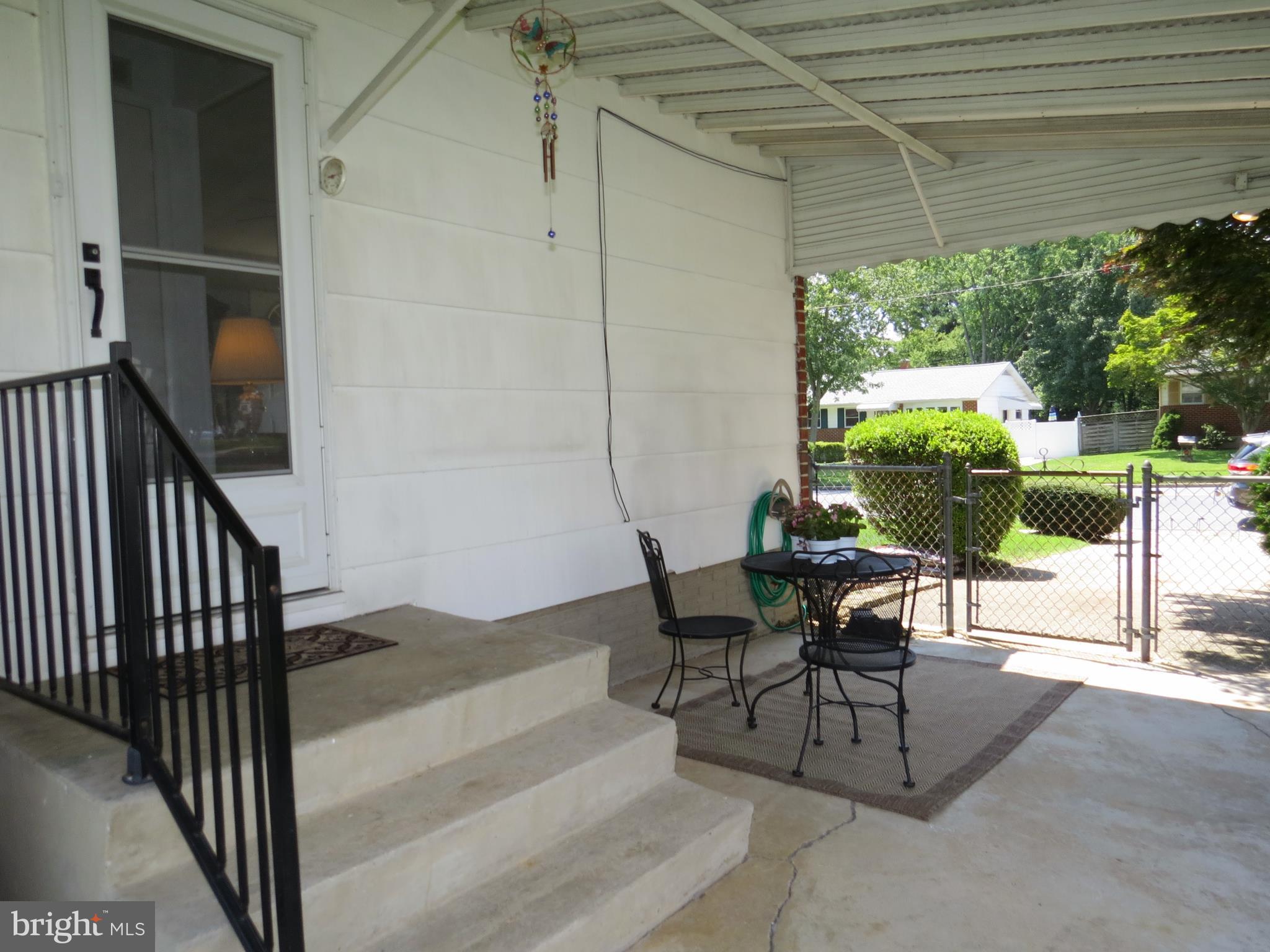311 Highfalcon Road Reisterstown, MD 21136 - Photo 23 of 24 a view of a porch with furniture and a yard