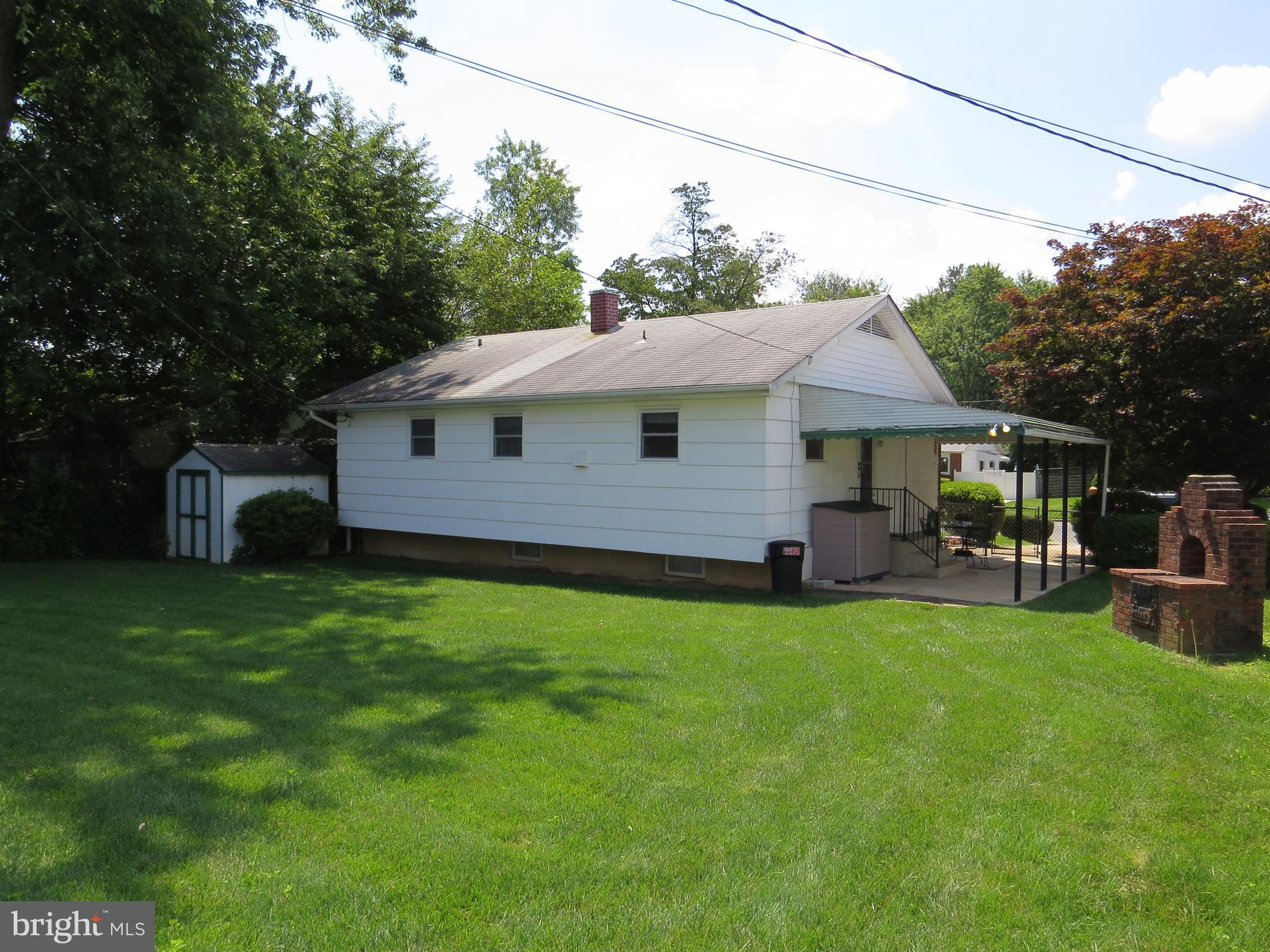 311 Highfalcon Road Reisterstown, MD 21136 - Photo 24 of 24 a front view of a house with a garden