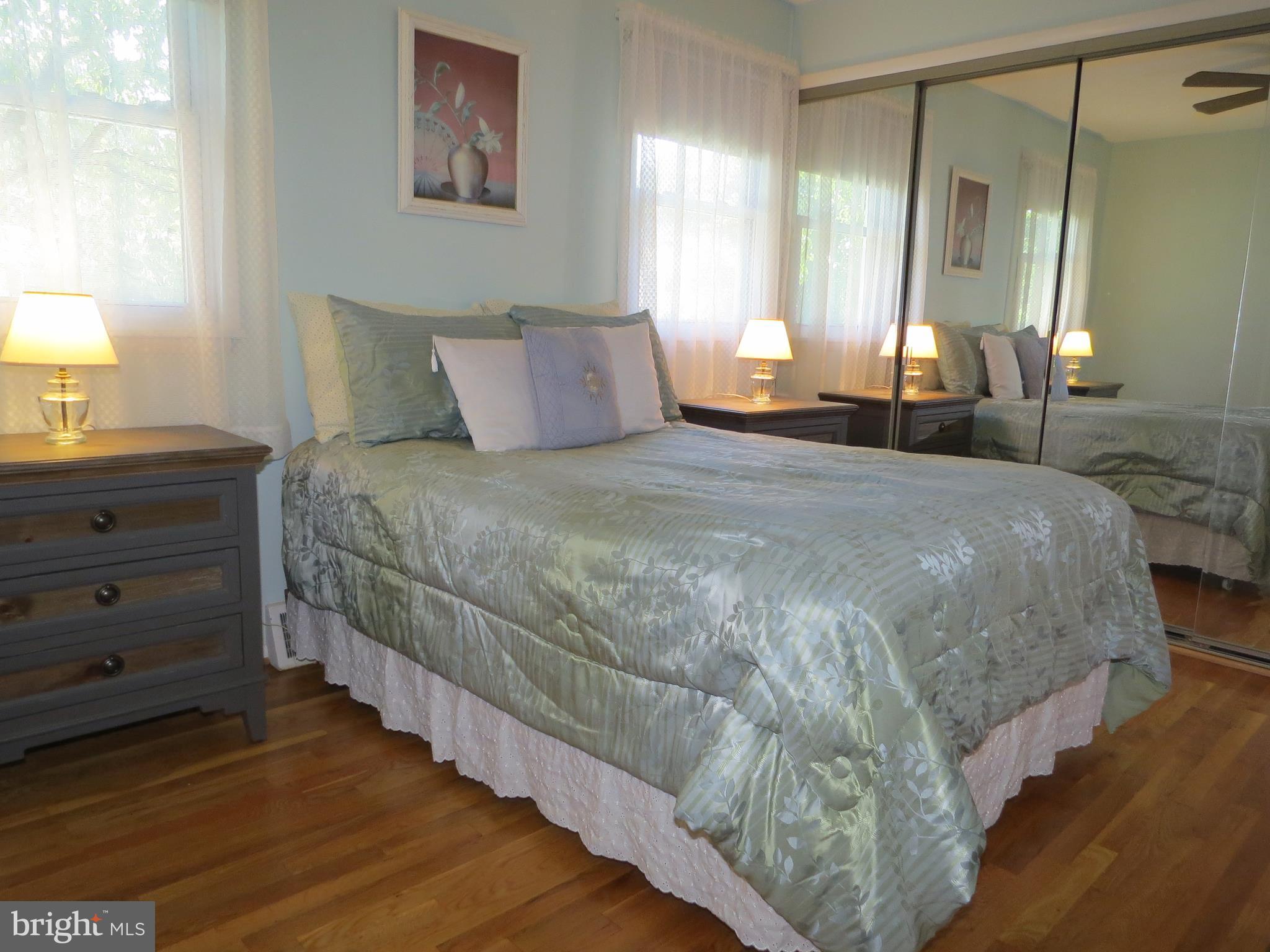 311 Highfalcon Road Reisterstown, MD 21136 - Photo 9 of 24 a bedroom with a bed and a lamp