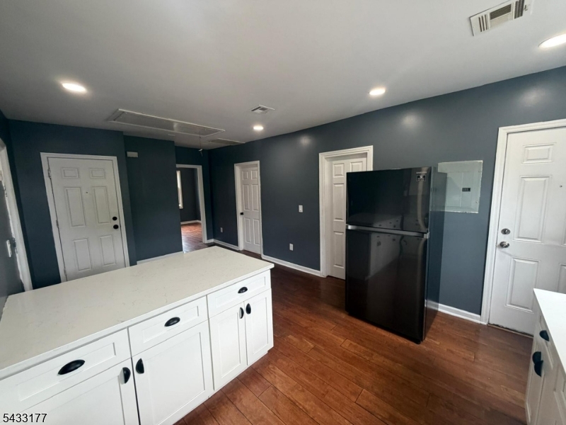 166 Renner Avenue, Unit 3 Newark, NJ 07112 - Photo 5 of 24 a kitchen with granite countertop a refrigerator and a sink