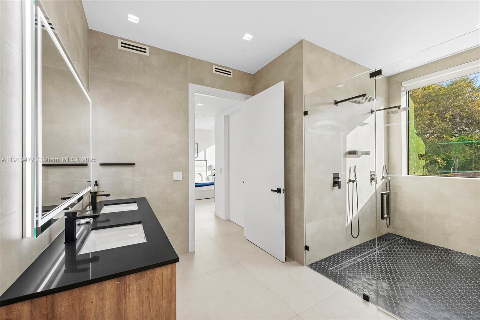 2572 Northeast 182nd Terrace North Miami Beach, FL 33160 - Photo 26 of 42 a view of a hallway with a kitchen