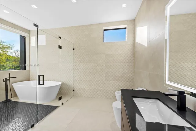 a bed room with a bed and a large window