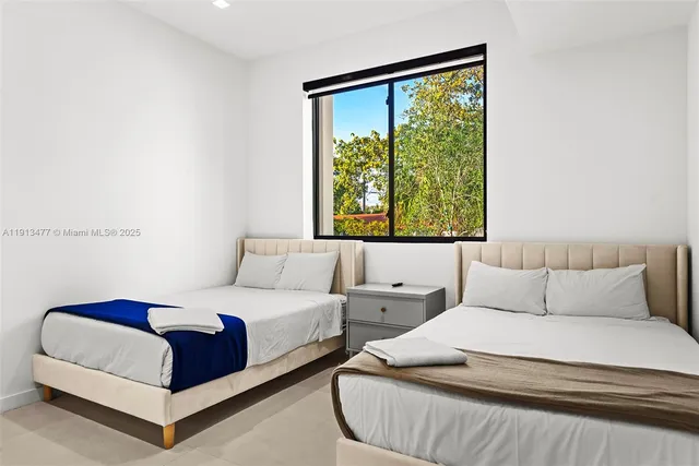 a living room with couches and a large window