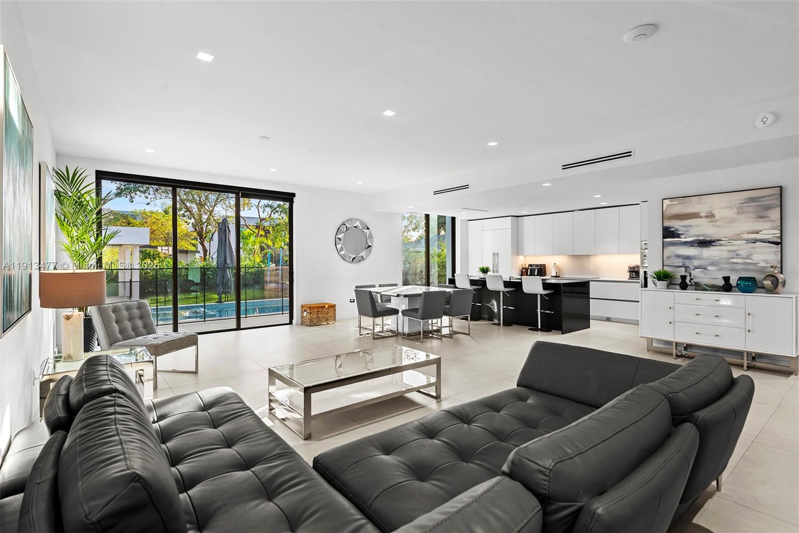 2572 Northeast 182nd Terrace North Miami Beach, FL 33160 - Photo 10 of 42 a living room with furniture and a large window
