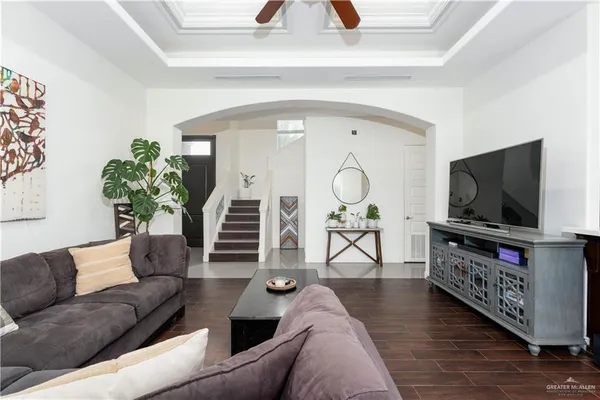 a living room with furniture and a flat screen tv