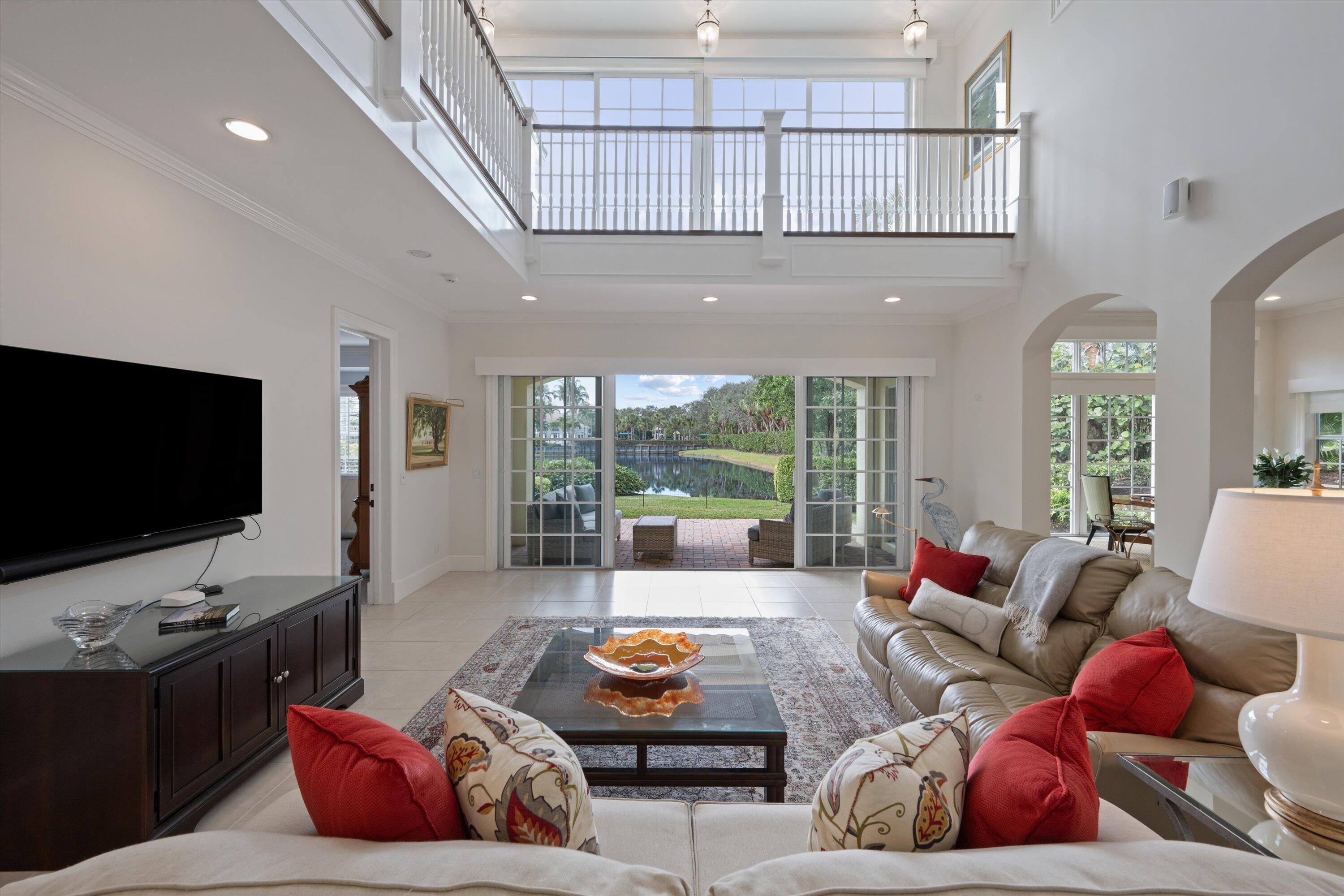 113 Caballo Lane Jupiter, FL 33458 - Photo 12 of 51 a living room with furniture and a flat screen tv