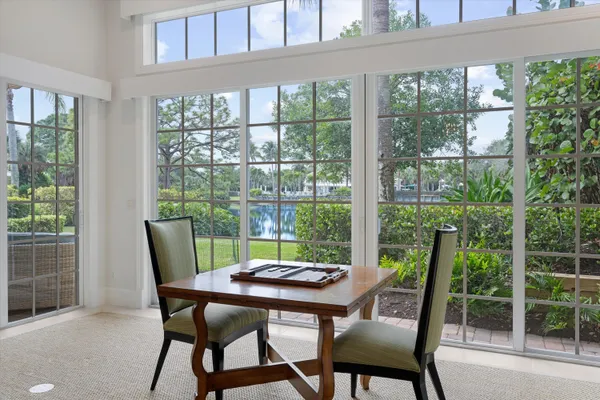 a view of a dining room with furniture window and outside view