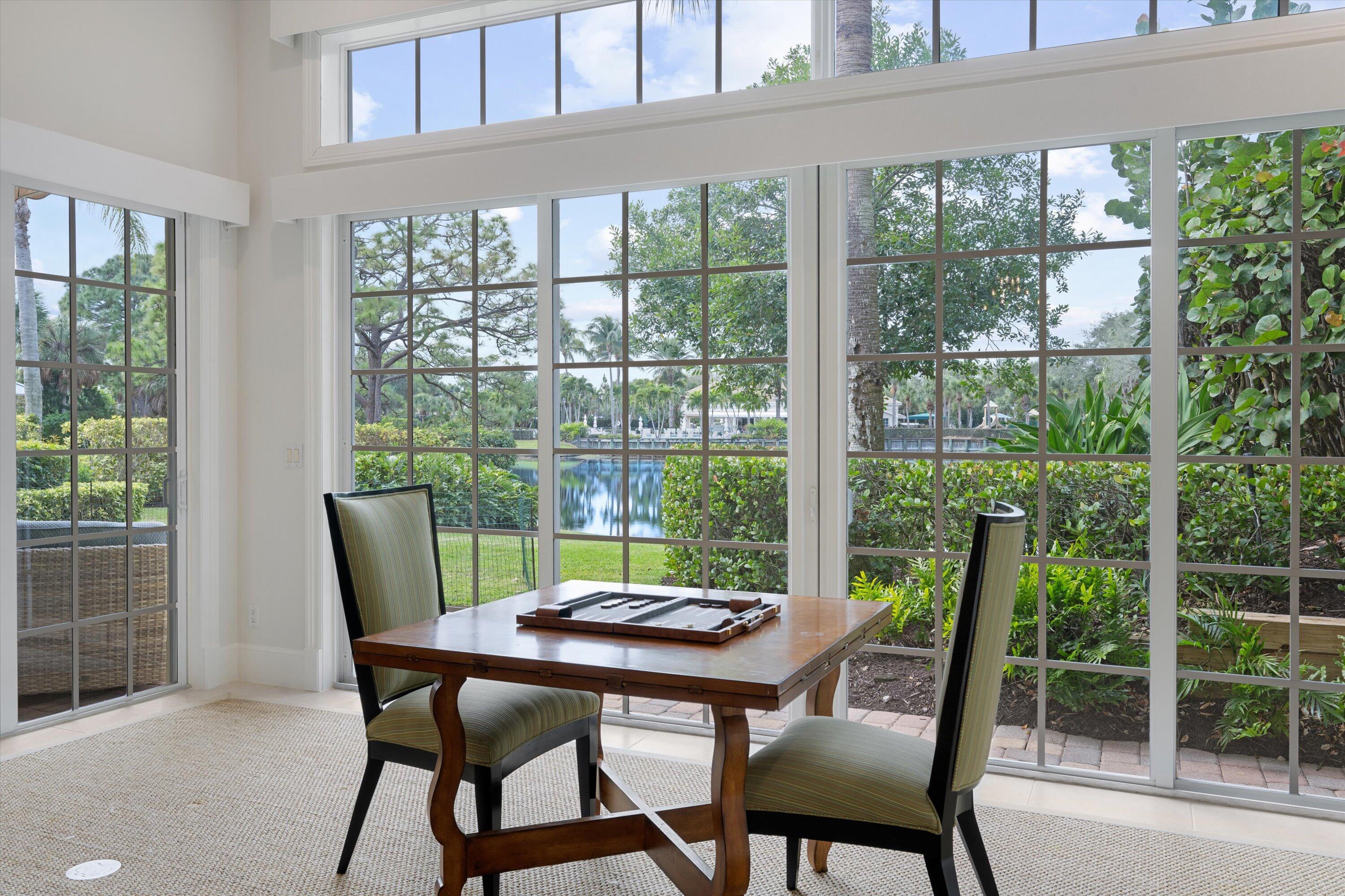 113 Caballo Lane Jupiter, FL 33458 - Photo 23 of 51 a view of a dining room with furniture window and outside view