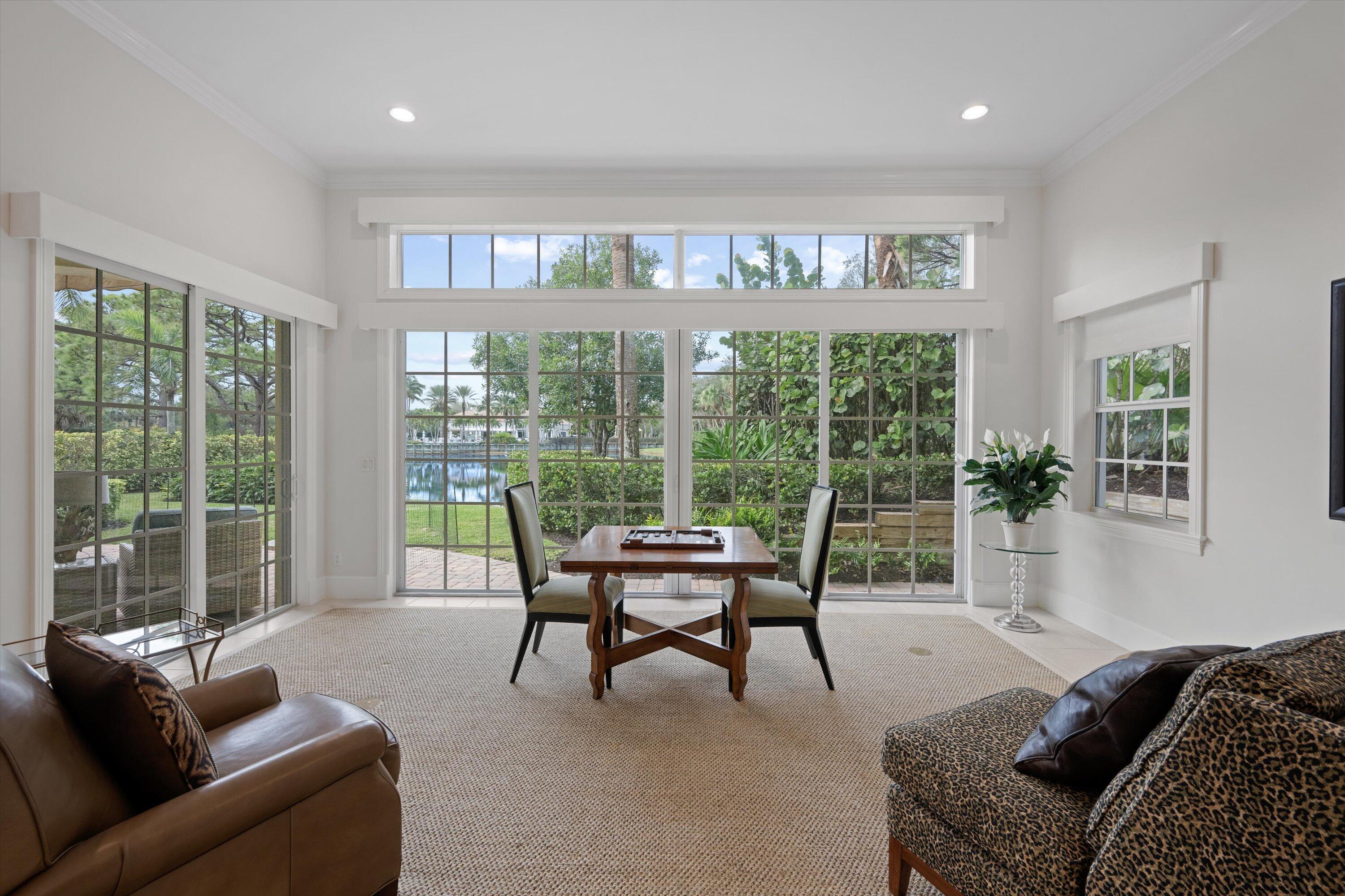 113 Caballo Lane Jupiter, FL 33458 - Photo 25 of 51 a living room with furniture and a large window