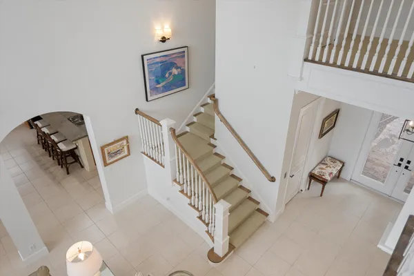 a view of staircase with white walls