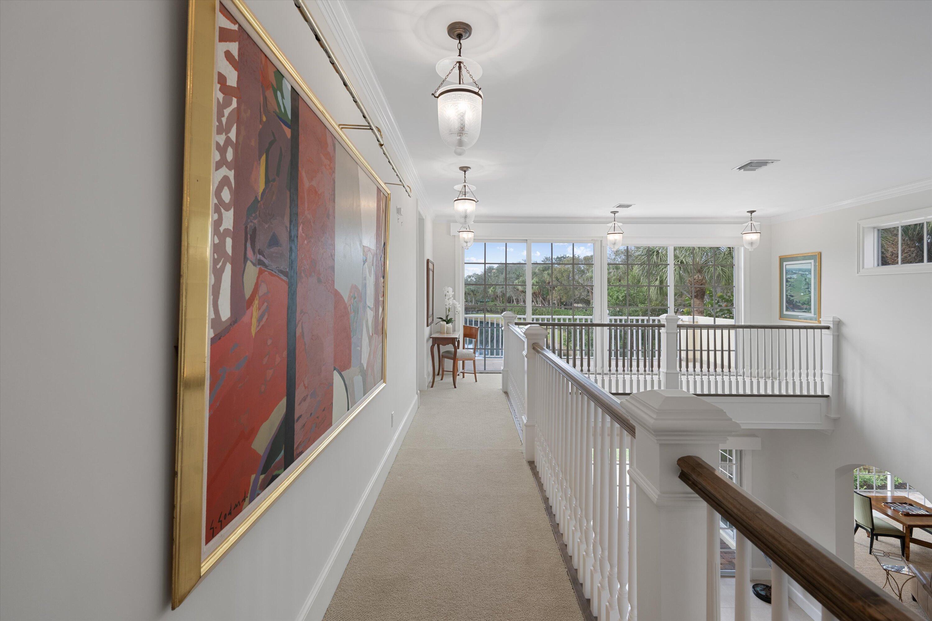 113 Caballo Lane Jupiter, FL 33458 - Photo 30 of 51 a view of a hallway with wooden floor and windows