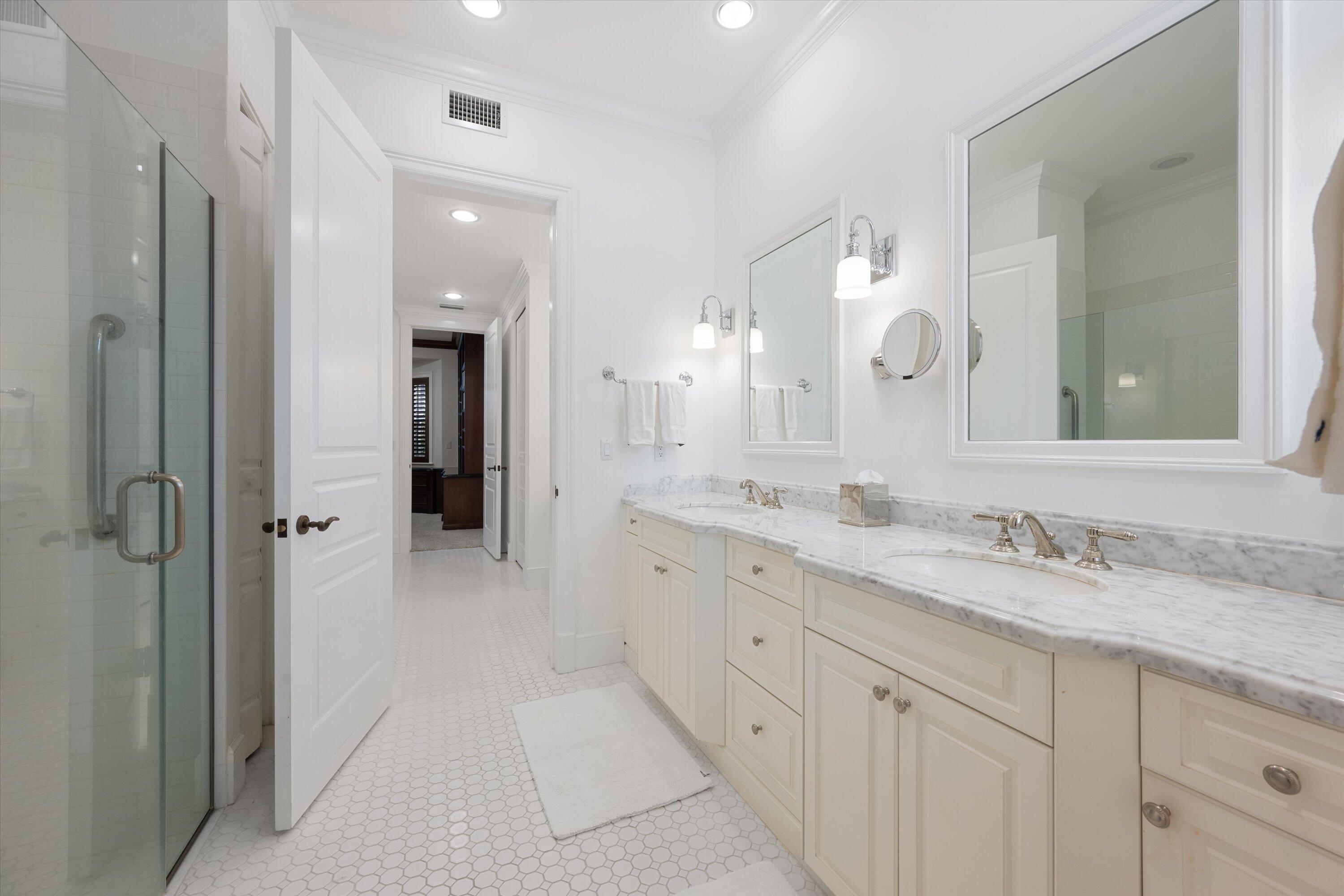 113 Caballo Lane Jupiter, FL 33458 - Photo 33 of 51 a spacious bathroom with a granite countertop sink mirror and a shower